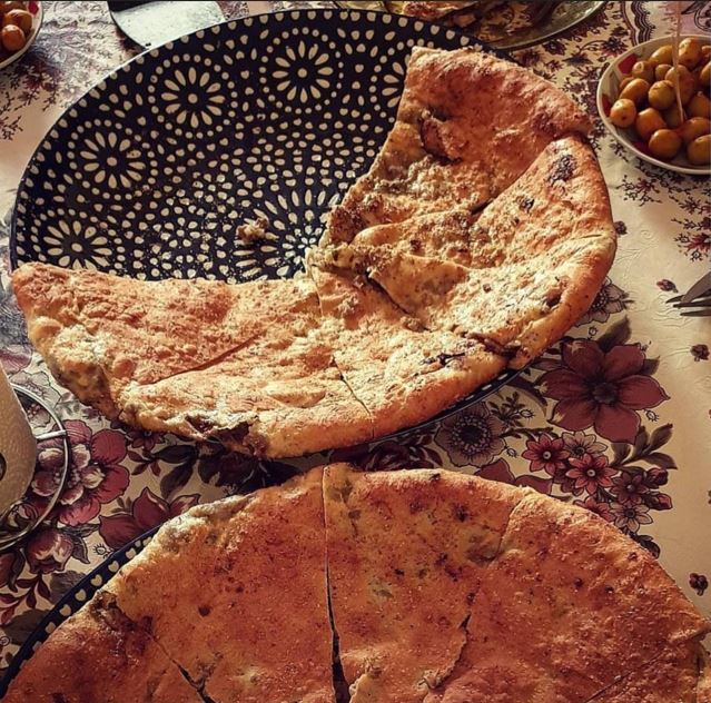 Taste an authentic Madfouna (Berber Pizza) lunch prepared by local villagers.